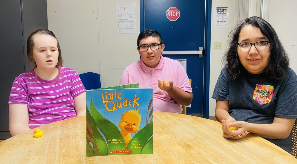 Students with rubber ducks and LITTLE QUACK book